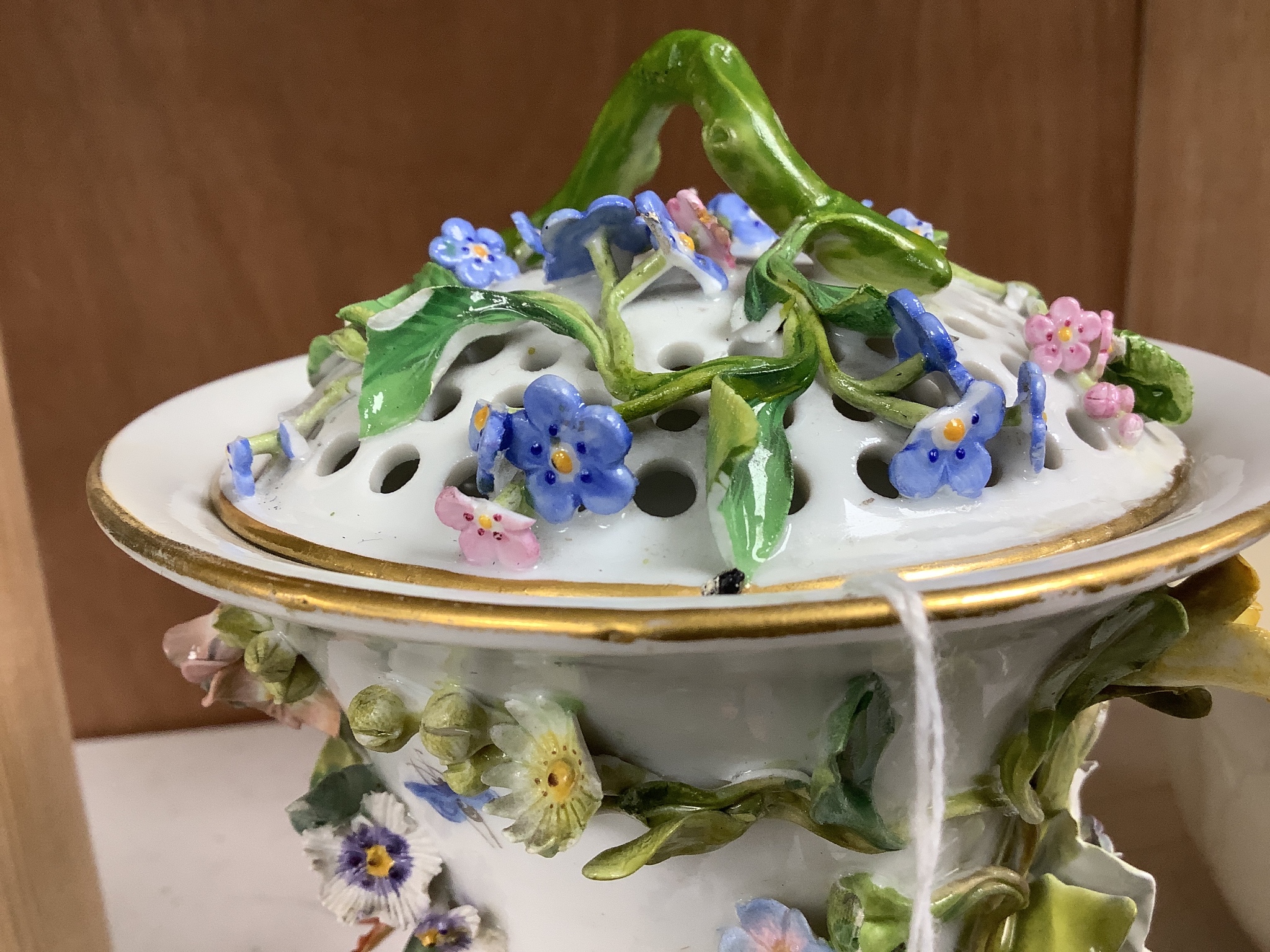 Two similar 19th century Meissen pot pourri vases and one cover, tallest 20cm